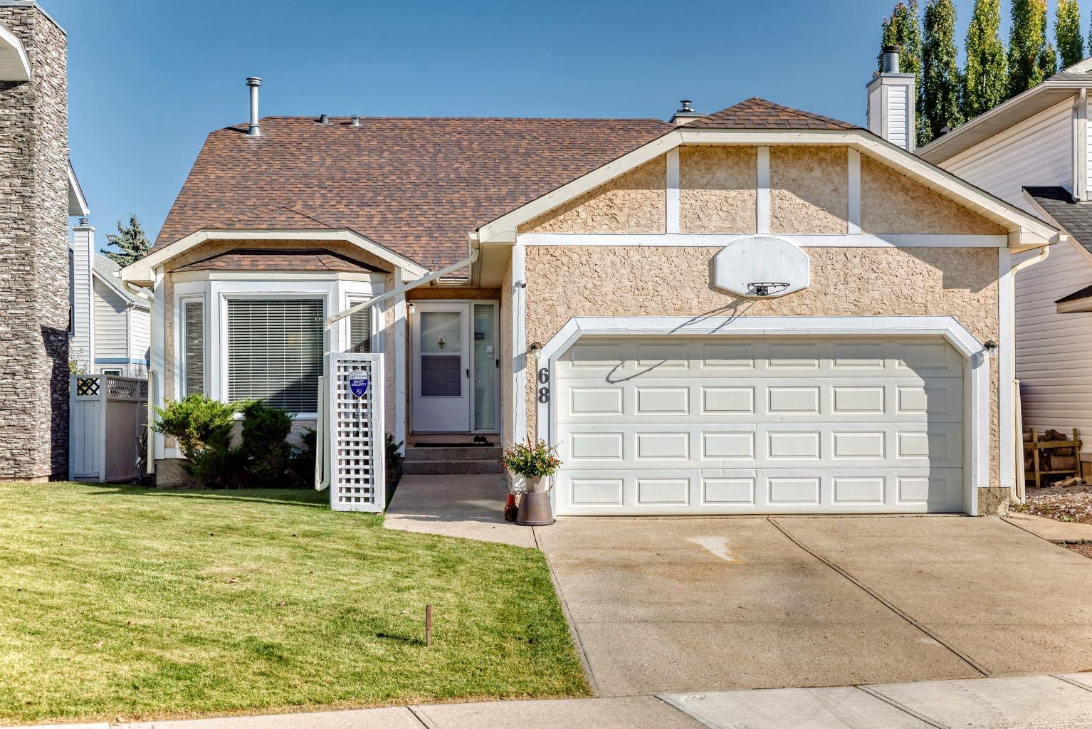 68 Woodmark Cres SW, Calgary, AB T2W 4Z2