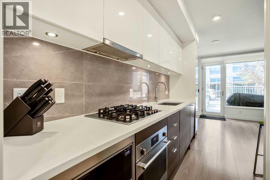 108 Waterfront Court Sw Unit 103, Calgary, AB T2P 1K7